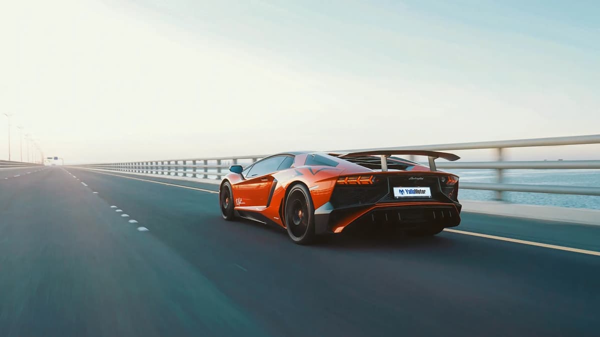 Luxury Lamborghini sports car with YallaMotor branding representing premium automotive audience